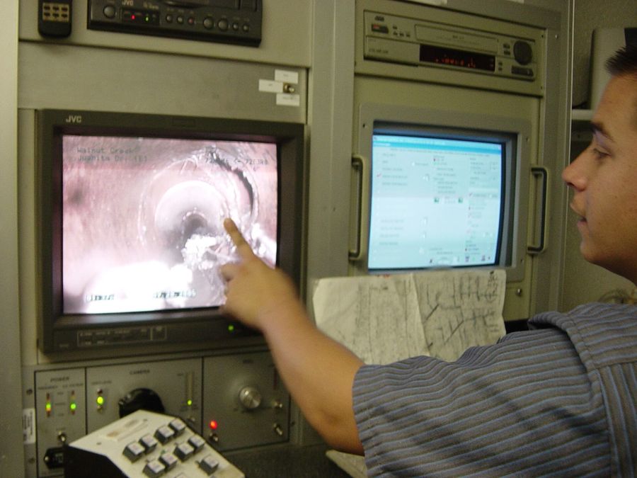 Camera inspection monitor showing pipe video
